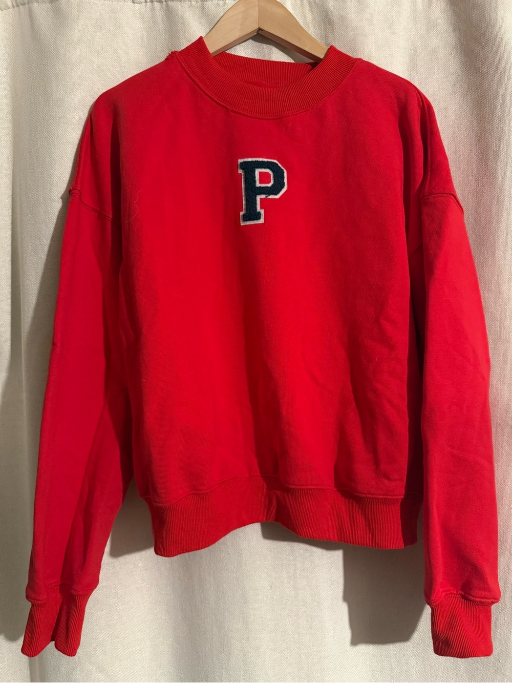 Red  parke Crewneck Sweater - has a hole next to the neck to the shoulder.